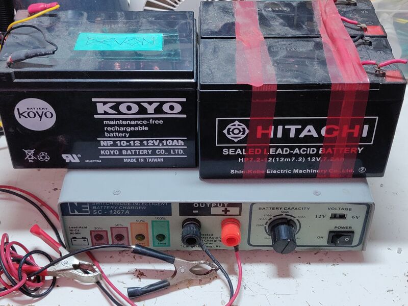 Photo of lead-acid batteries on top of charger